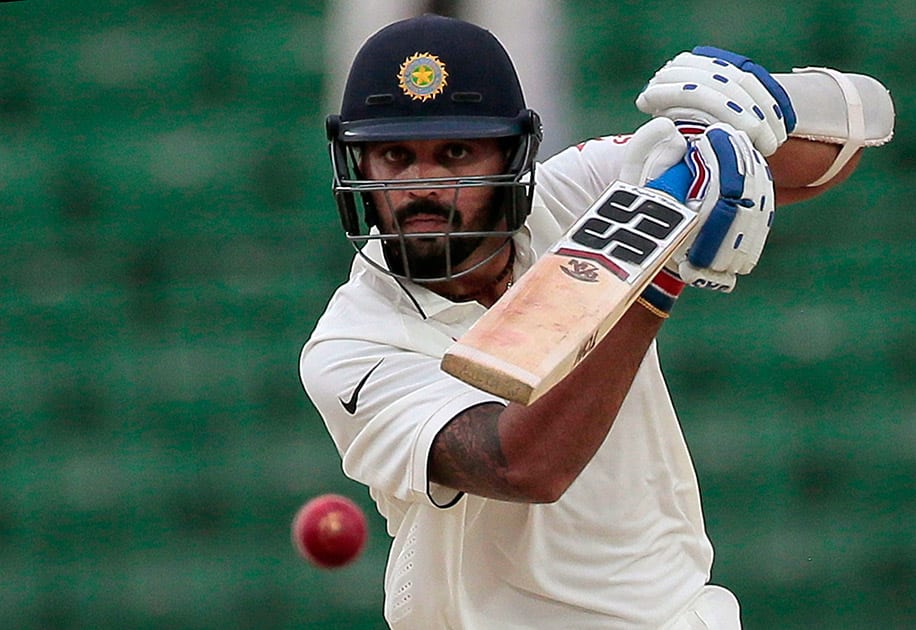 Murali Vijay plays a shot during the first day of their test cricket match against Bangladesh in Fatullah, Bangladesh.