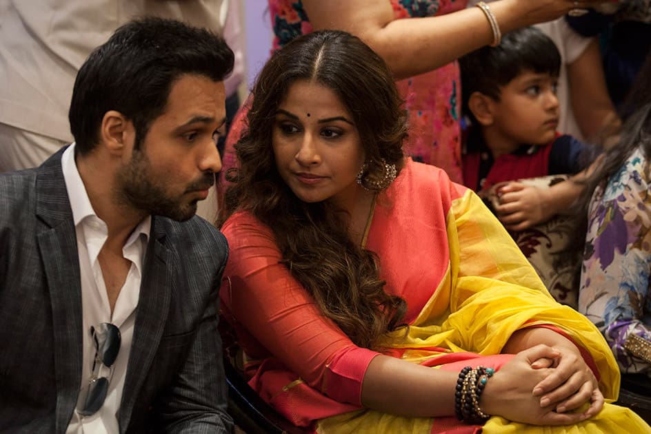 Bollywood actress Vidya Balan, listens to actor Emran Hashmi during a promotional event of their forthcoming movie 'Hamari Adhuri Kahani' in New Delhi. Hamari Adhuri Kahani or Our Incomplete Story, a romantic drama is scheduled to hit the theaters on June 12. 