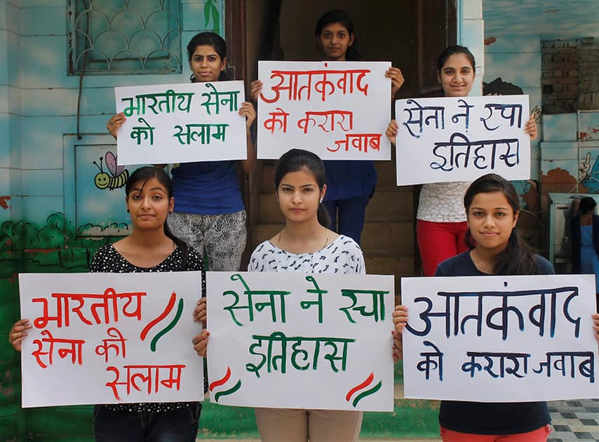 Girls holding placards praising Armys action against terrorists in Myanmar, in Faridabad.