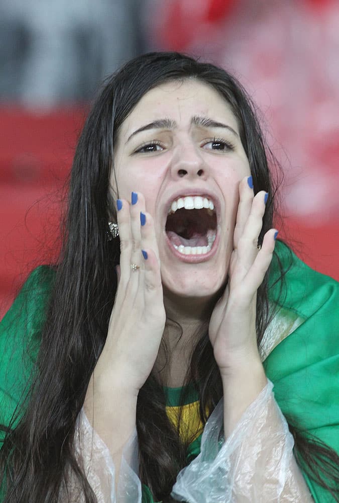 A Brazilian fan cheers before a friendly soccer match between Brazil and Honduras in Porto Alegre, Brazil.