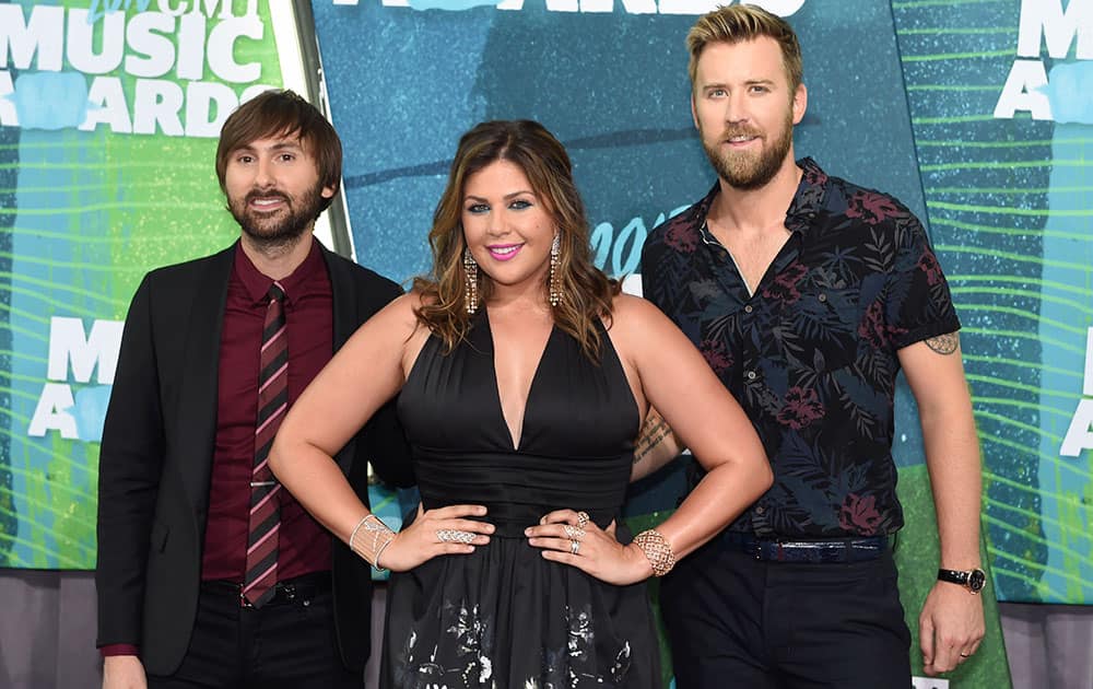 Dave Haywood, from left, Hillary Scott and Charles Kelley, of Lady Antebellum, arrive at the CMT Music Awards at Bridgestone Arena, in Nashville, Tenn. 