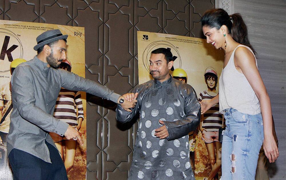 Bollywood actors Ranveer Singh, Aamir Khan and Deepika Padukone during the success party of film PK in Mumbai.