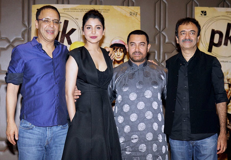 Bollywood actors Aamir Khan and Anushka Sharma with filmmakers Rajkumar Hirani and Vidhu Vinod Chopra during the success party of film PK in Mumbai.