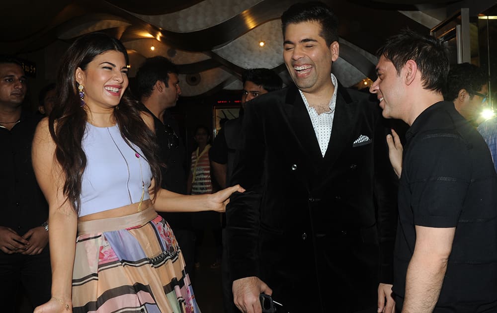 Karan Johar and Jacqueline Fernandes during the trailer launch of movie Brothers at PVR, Juhu in Mumbai. DNA