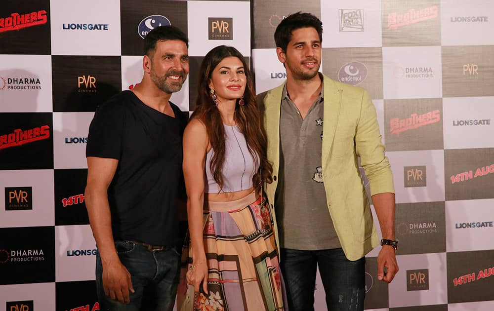 Bollywood actress, Jacqueline Fernandez poses with co actors Akshay Kumar and Sidharth Malhotra during the trailer launch of her upcoming film ‘Brothers’ in Mumbai.