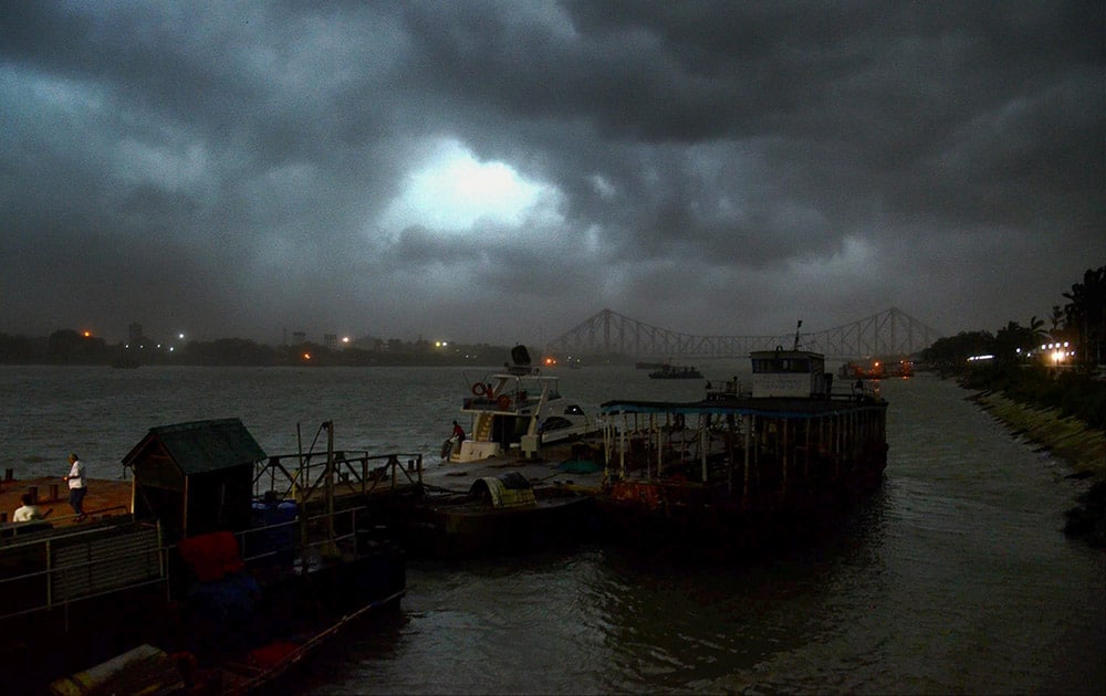 Dark clouds & heavy wind covers the sky of Kolkata near Howarh Bridge on the first day of Monsoon in Kolkata.