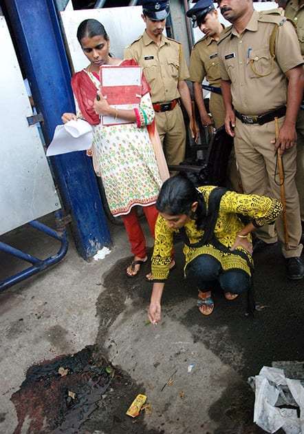 Forensic officials investigate the spot where a CISF jawan was shot dead in a clash at Calicut International Airport in Kozhikode.