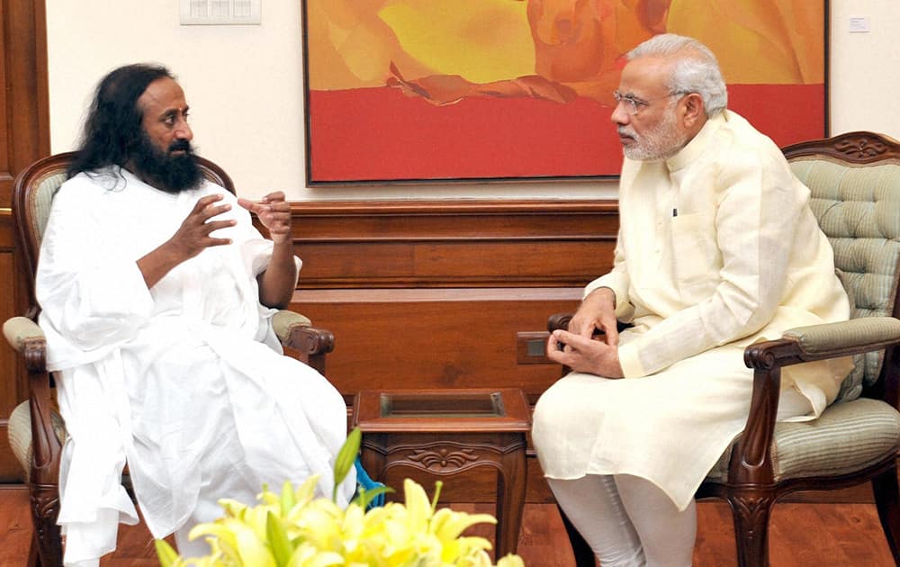 Prime Minister Narendra Modi with Sri Sri Ravi Shankar at a meeting in New Delhi.