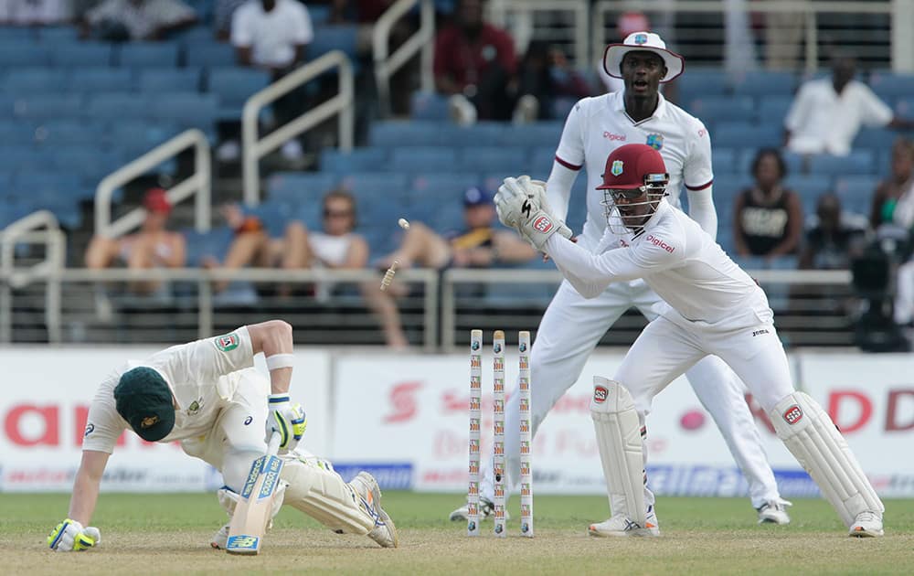 West Indies' wicket keeper Denesh Ramdin shouts after attempting to stump Australia's Steven Smith during the first day of the second cricket Test match in Kingston, Jamaica.