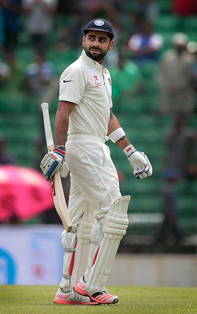 Virat Kohli walks back to the pavilion after his dismissal by Bangladesh’s Jubair Hossain during the third day test cricket match in Fatullah, Bangladesh.