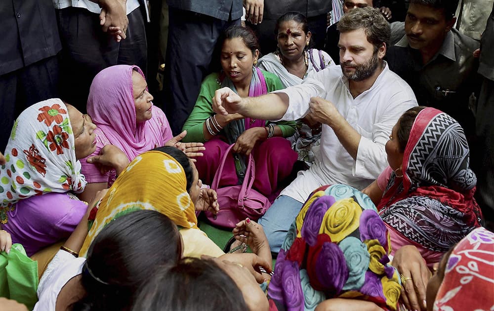 Congress Vice President Rahul Gandhi sitting with Sanitation workers during their ongoing protest for dues, at Patparganj in East Delhi.