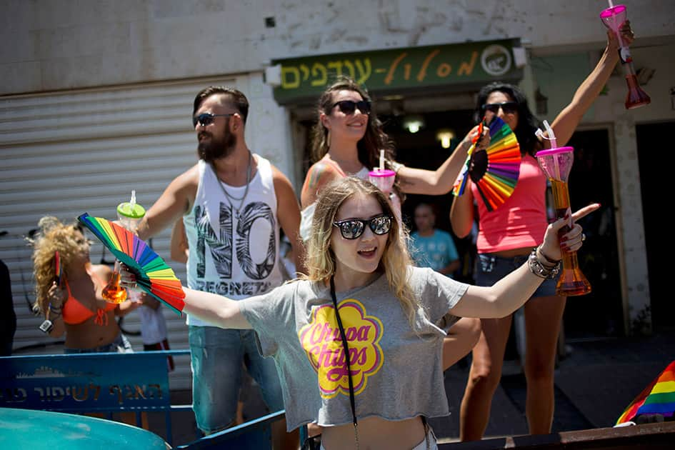 People dance during the annual Gay Pride Parade in Tel Aviv, Israel.