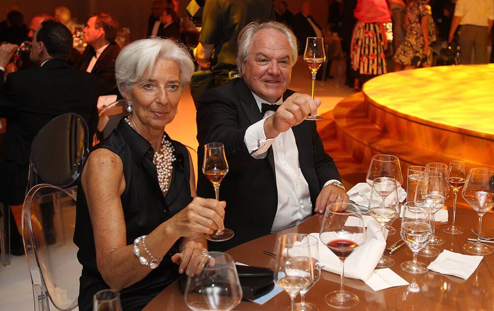 IMF Managing Director Christine Lagarde and Chairman and CEO, Moet Hennessy Christophe Navarre are seen making a toast at the Moet Hennessy Celebration of the Hermione Voyage 2015 at George Washington's Mount Vernon, in Mount Vernon, Va. 