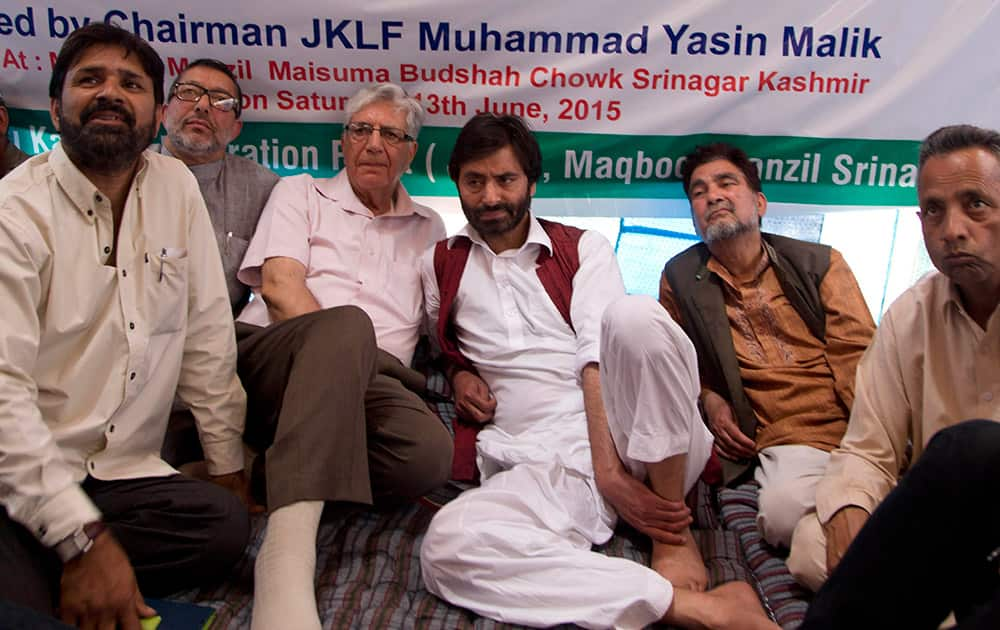 Yasin Malik, sits with other party workers on a daylong hunger strike in Srinagar.