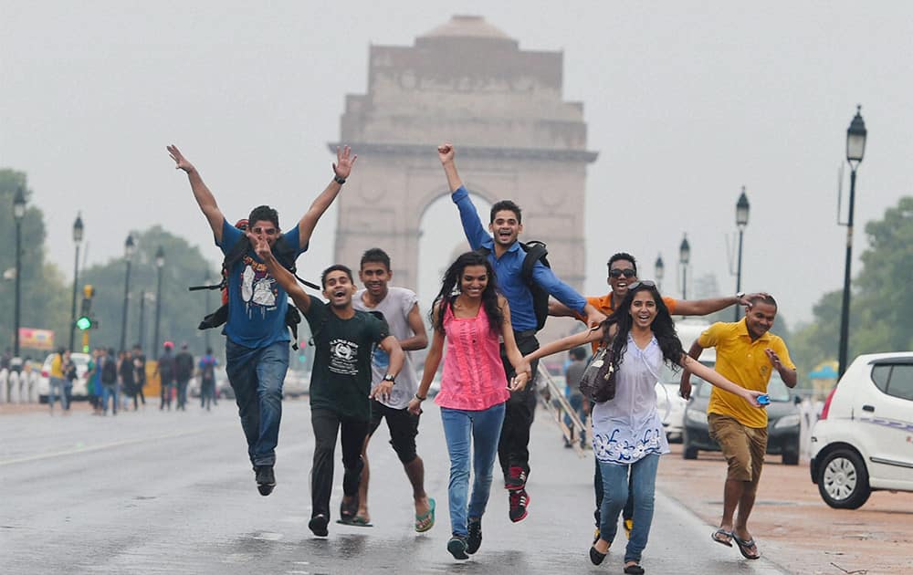 Youngsters enjoying the pre-monsoon showers at India Gate in New Delhi.