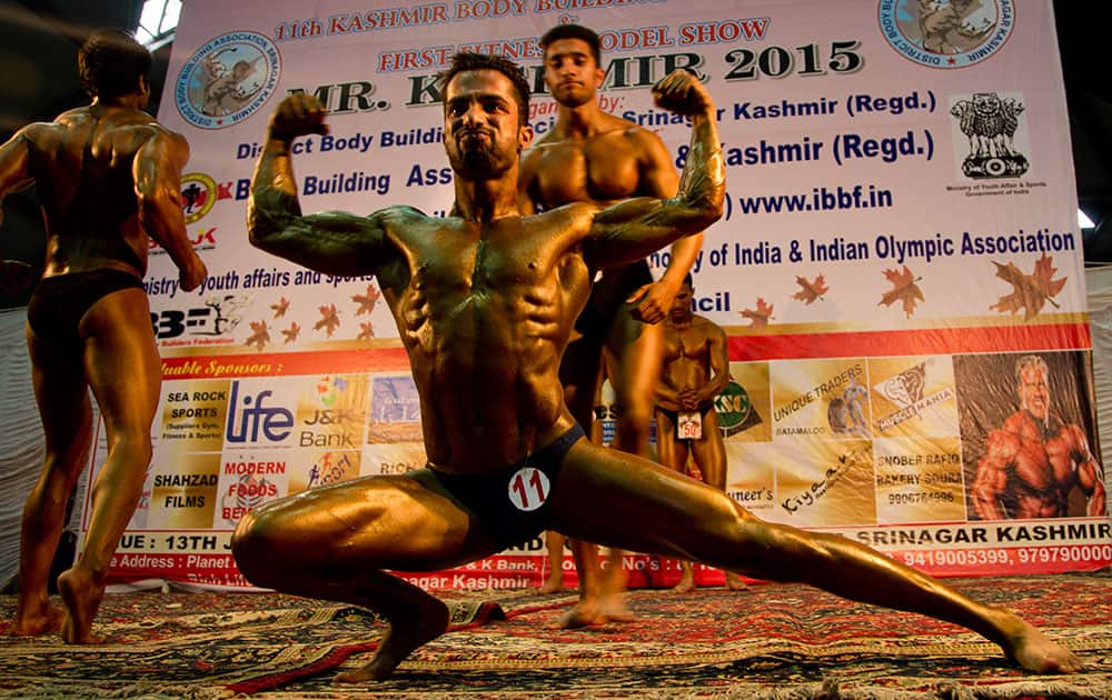 Kashmiri bodybuilders display their muscles during a Jammu-Kashmir state level bodybuilding competition in Srinagar, India.