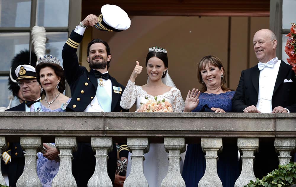King Carl Gustaf, Queen Silvia, Prince Carl Philip, Sofia Hellqvist, Marie and Erik Hellqvist, are greeted by the people after their wedding in the Royal Chapel in Stockholm, Sweden.
