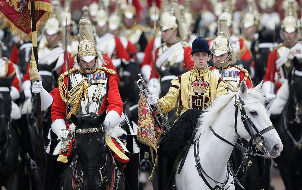 The Household Cavalry ride down the Mall during the Trooping The Colour parade at Buckingham Palace, in London.