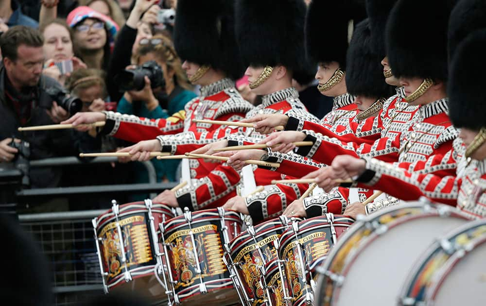 Soldiers march during the Trooping The Colour parade at Buckingham Palace, in London.