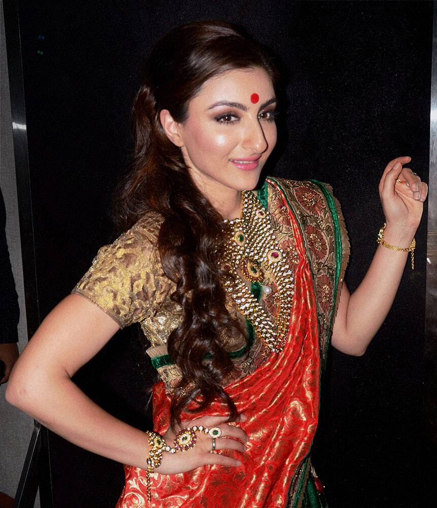 Bollywood Film actress Soha Ali Khan walks the ramp at a fashion show for street children charity in Kolkata.