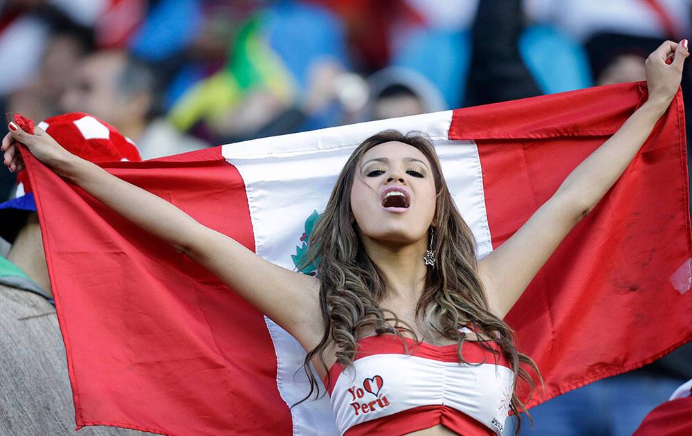 A fan of Peru cheers before the start of a Copa America Group C soccer match against Brazil at the Bicentenario Germán Becker stadium in Temuco, Chile.