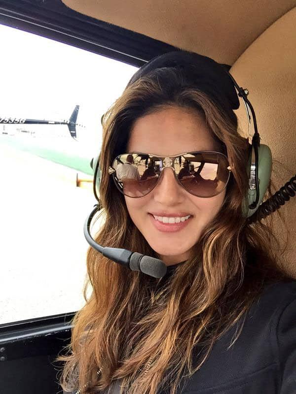 Sunny Leone ‏:- Nothing like taking a helicopter to set!! Living the life!!!! With @DanielWeber99-twitter