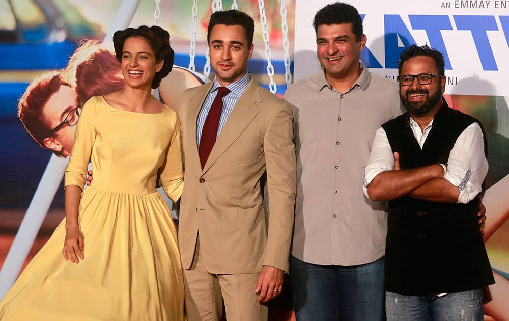 Bollywood actors Kangana Ranaut, left, Imran Khan, second left, director Nikhil Advani, right, and producer Siddharth Roy Kapur pose for photographs during the trailer launch of their forthcoming movie “Katti Batti” in Mumbai.