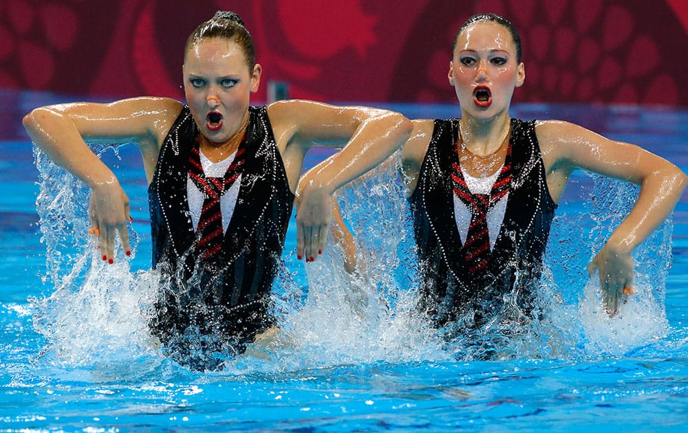 Valeriya Filenkova and Daria Kulagina of Russia perform during the final of synchronised swimming duets event at the 2015 European Games in Baku, Azerbaijan.