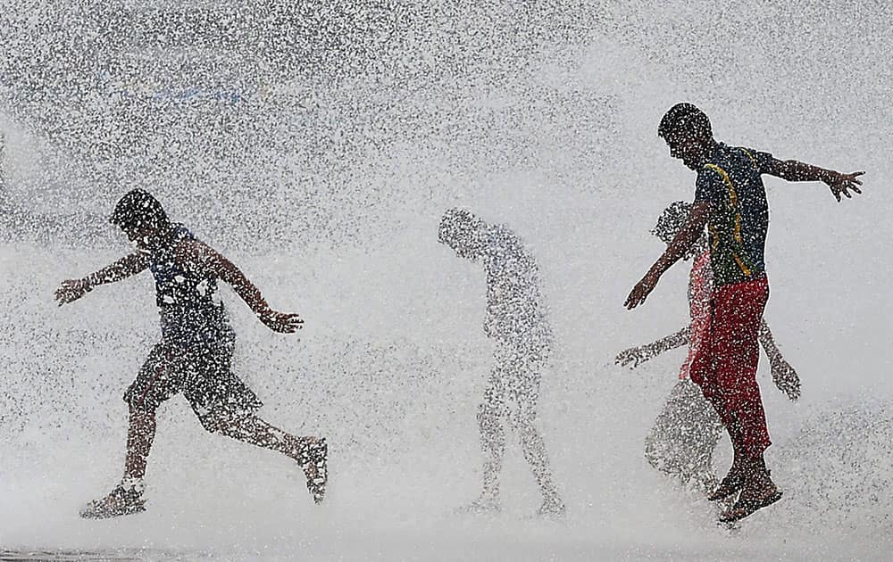 Mumbaikars enjoy high tide during monsoon season in Mumbai.