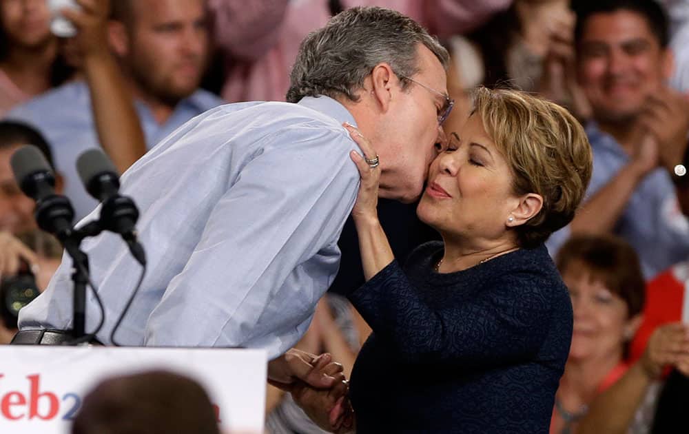 Former Florida Gov. Jeb Bush kisses his wife Columba after announcing his bid for the Republican presidential nomination, at Miami Dade College in Miami. 