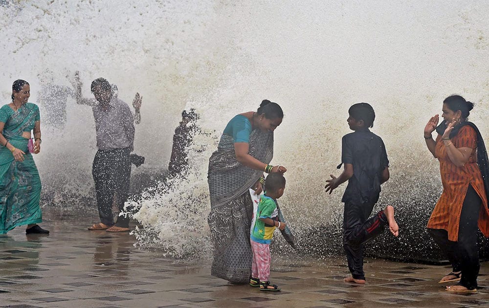  Mumbaikars enjoy high tide during monsoon season in Mumbai.