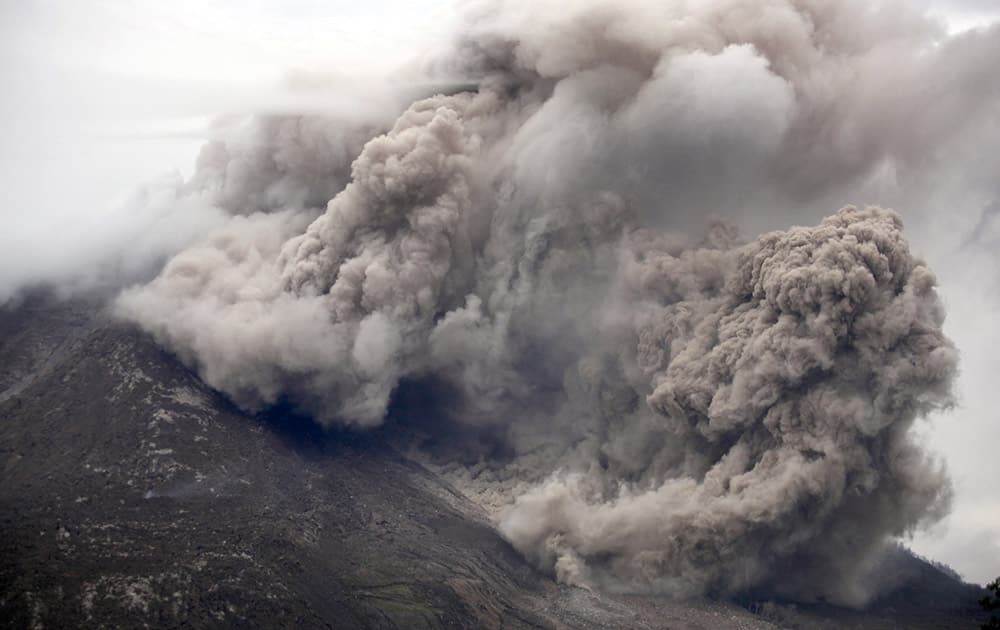 Mount Sinabung releases pyroclastic flows as seen from Tiga Serangkai, North Sumatra, Indonesia.