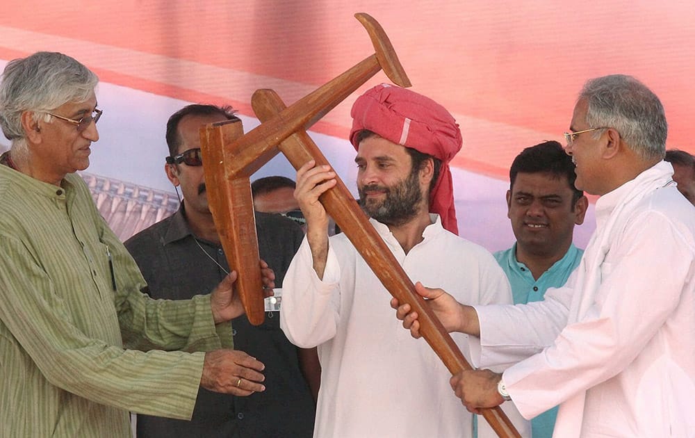 Congress Vice President Rahul Gandhi is presented a plough at a public meeting in Chhattisgarhs Janjgir-Champa district.