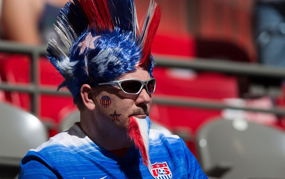A U.S. fan watches as the team warms up for a FIFA Women's World Cup soccer game between Nigeria and the United States, in Vancouver, British Columbia, Canada.
