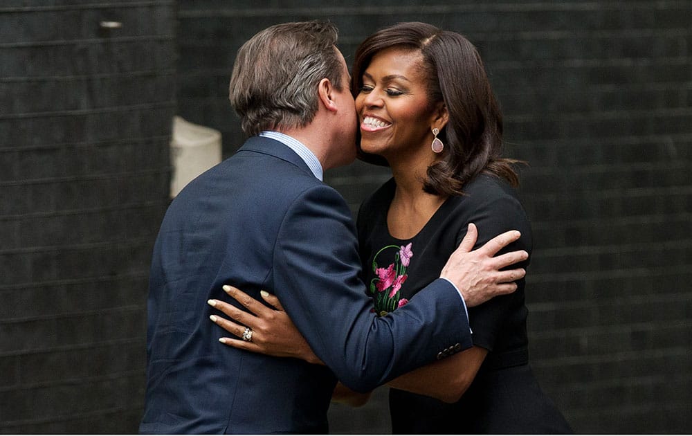 U.S. first lady Michelle Obama is greeted by British Prime Minister David Cameron and his wife Samantha, as she arrives to visit them at 10 Downing Street in, London.
