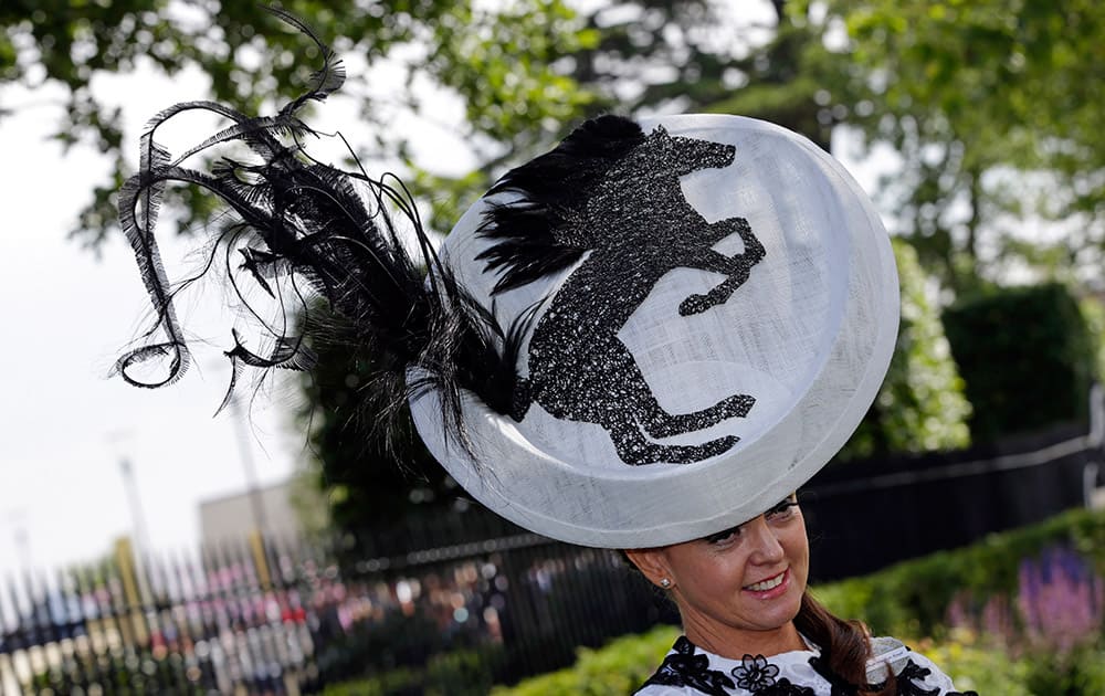 Gail Hayden-Stapf poses for photographers as she arrives for the first day of Royal Ascot horse racing meet at Ascot, England