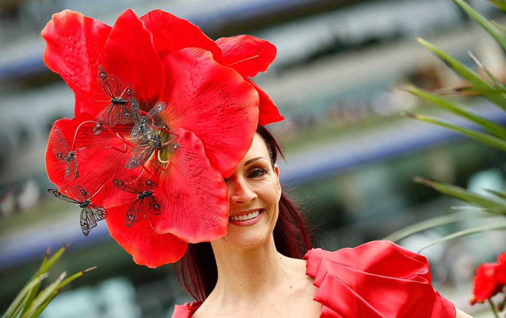 Chelsey Baker smiles as she poses for photographers on the second day of Royal Ascot horse racing meet at Ascot, England.