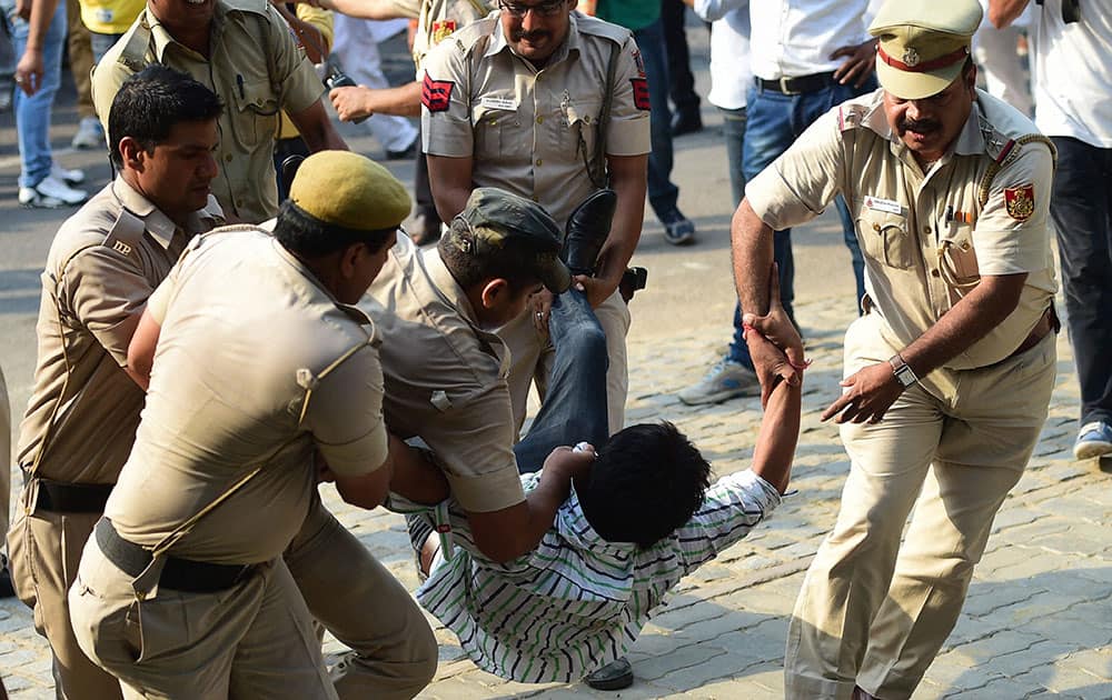 Youth Congress members being detained by the police during their protest against union Minister Sushma Swaraj at Teen Murti in New Delhi.