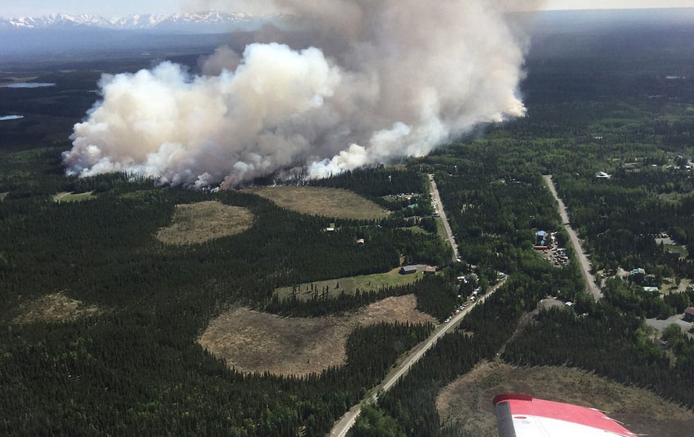 the initial attack of the Card Street Fire burning on the Kenai Peninsula, between the Sterling Highway and the Kenai River near Sterling, Alaska.