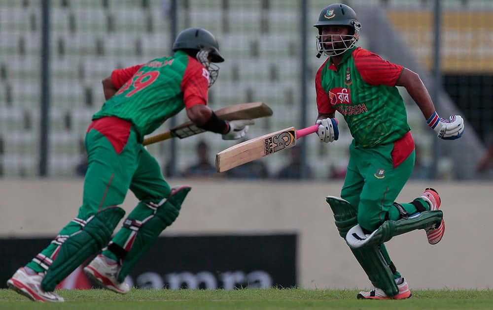 Bangladesh’s Tamim Iqbal and his teammate Soumya Sarkar run between the wickets during the first one-day international cricket match against India in Dhaka, Bangladesh.