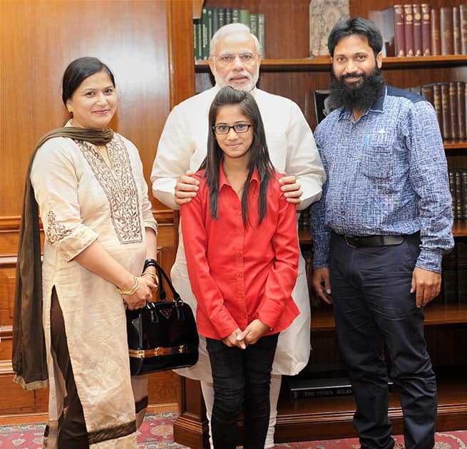 Prime Minister Narendra Modi meets Maryam Asif Siddiqui and her parents, winner of Gita Champions League (GCL), in New Delhi.