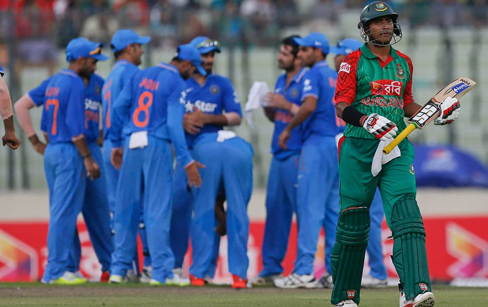 Bangladesh’s Soumya Sarkar walks back after his dismissal by India’s Suresh Raina during the first one-day international cricket match against India in Dhaka, Bangladesh.