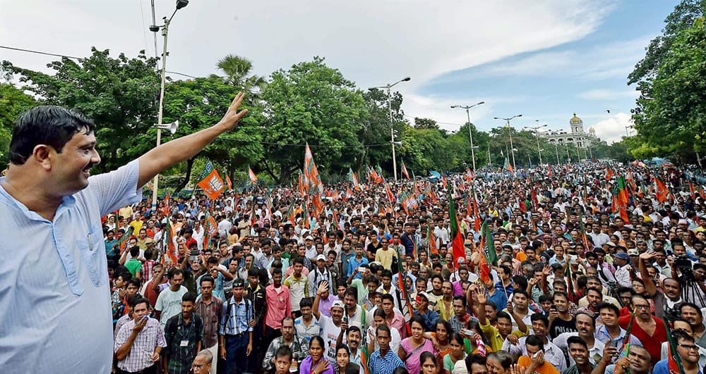 BJP State President Rahul Sinha waving hands to party activists participate in a rally in Kolkata on Thursday to protest against West Bengal Government for deteriorating law and order situation in the State and demanding minimum supporting price of rice for the poor farmers in the rural areas.