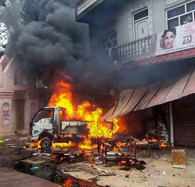 Angry villagers set ablaze vehicles and shops after a shopkeeper was murdered by un-identified people at Sangipur Tehsil in Pratapgarh District of Uttar Pradesh.