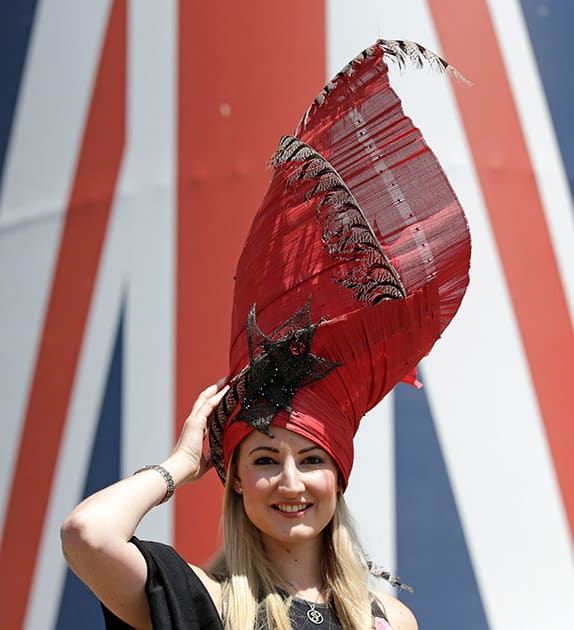 Saxon Prentice poses for photographers as she arrives for the third day of the Royal Ascot horse racing meet at Ascot, England.