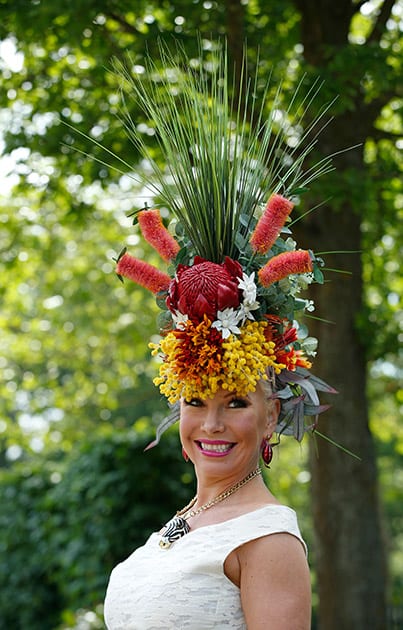 Anna Mott poses for photographers as she arrives for the third day of the Royal Ascot horse racing meet at Ascot, England.