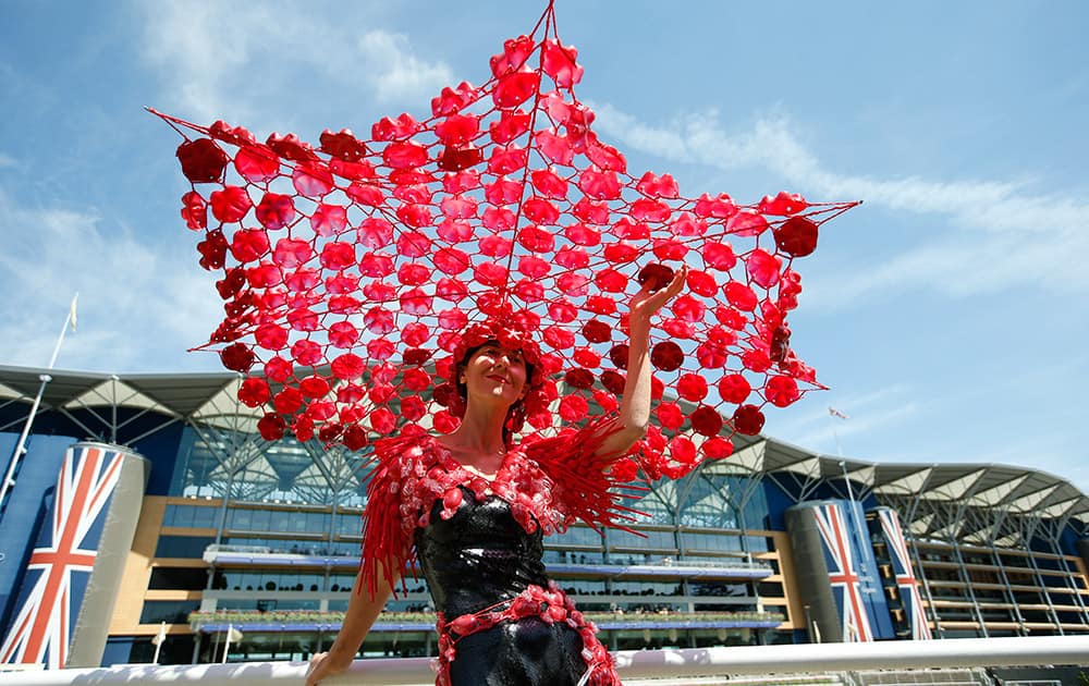 Larisa Katz wears an ornate hat on the third day of the Royal Ascot horse racing meet at Ascot, England.