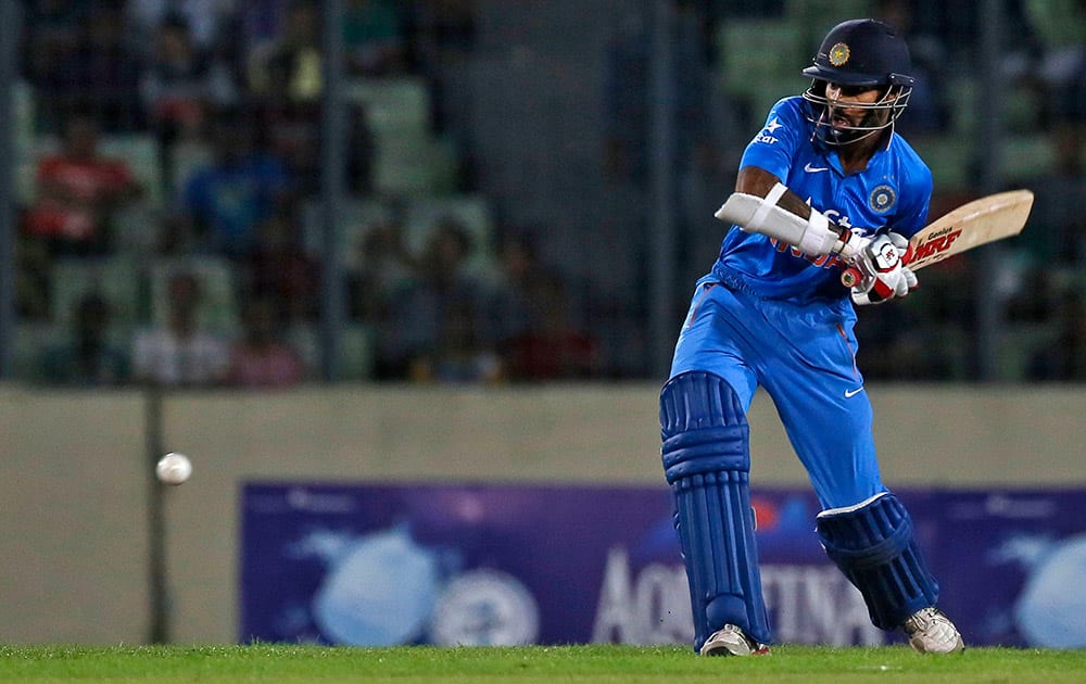 Shikhar Dhawan plays a shot during the first one-day international cricket match against Bangladesh in Dhaka, Bangladesh.