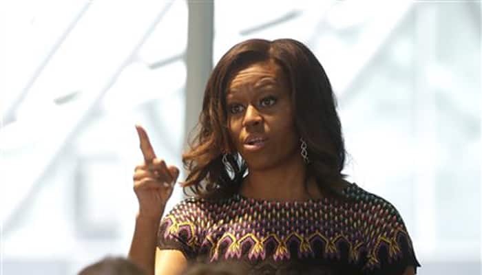Michelle Obama lights candles for US shooting victims