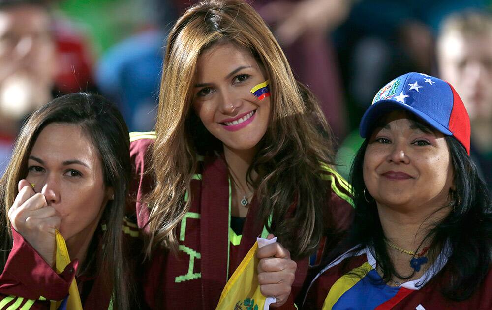 Venezuela's fan cheer for their team prior a Copa America Group A soccer match against Peru at the Elias Figueroa stadium in Valparaiso, Chile.